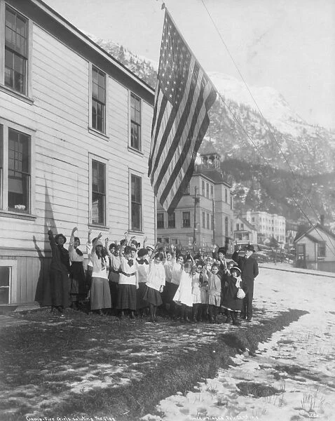 ALASKA: CAMP FIRE GIRLS. Camp Fire Girls of America group saluting the flag in Juneau, Alaska