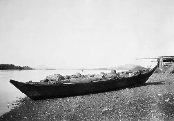 ALASKA: DUGOUT CANOE, 1905. A Tlingit dugout canoe on the shore at Sitka, Alaska