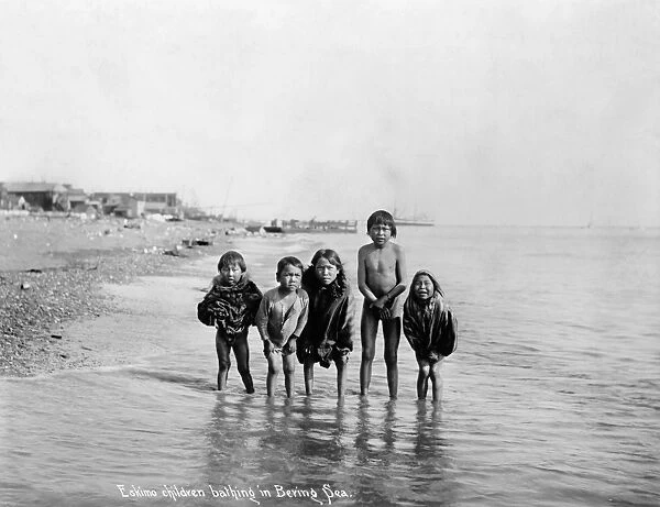ALASKA: ESKIMO CHILDREN. Five Eskimo children wading in the water in the Bering Sea, Alaska