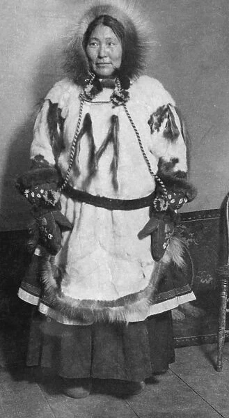 ALASKA: ESKIMO WOMAN. A portrait of an Eskimo woman wearing traditional clothing