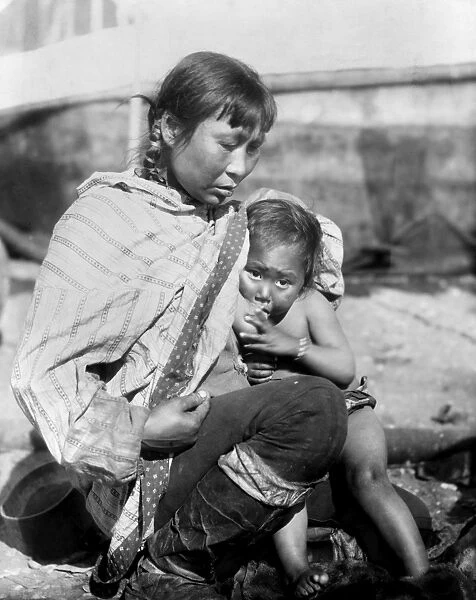 ALASKA: ESKIMOS, c1908. An Inuit woman breast-feeding her child, Alaska. Photograph