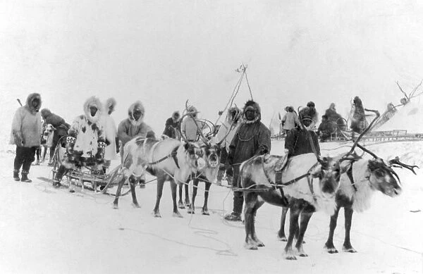 ALASKA: ESKIMOS, c1922. A group of Eskimo men in Alaska with their team of reindeer