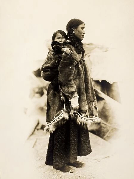 ALASKA: INUIT, 1903. An Inuit mother and child. Photograph, 1903