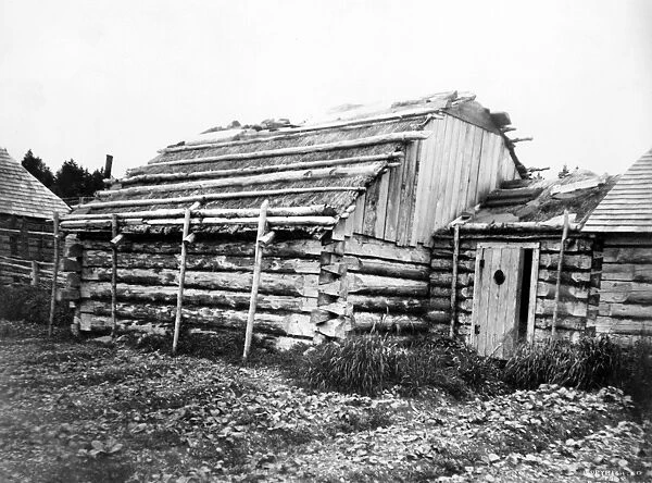 ALASKA: LOG CABIN, c1899. Log cabins in Kodiak, Alaska. Photograph by Edward Curtis