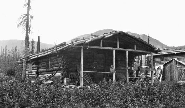 ALASKA: LOG CABIN, c1916. A homesteaders rural log cabin in Alaska. Photograph, c1916