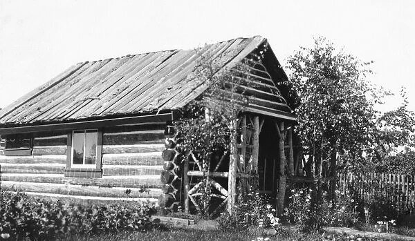 ALASKA: LOG CABIN. A log cabin in Fairbanks, Alaska. Photograph, c1900-1916