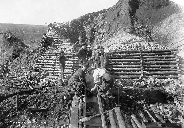 ALASKA: MINING, 1916. Men washing gold in Alaska. Photograph, 1916