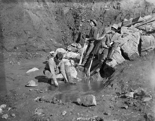 ALASKA: MINING, c1915. Miners panning for gold in Nome, Alaska. Photograph, c1915