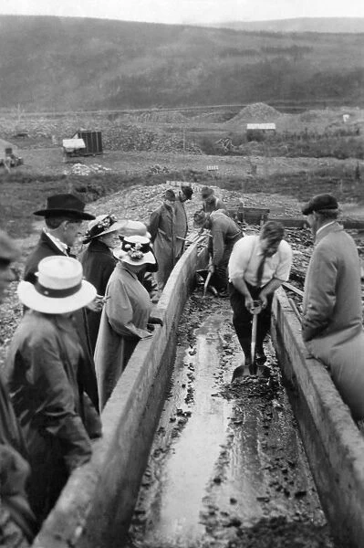 ALASKA: MINING, c1915. Miners taking gold out of a sluice box in Chatanika, Alaska