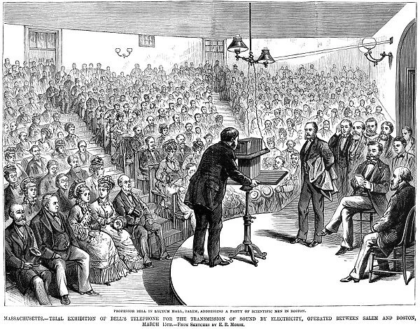 ALEXANDER GRAHAM BELL (1847-1922). American (Scottish born) teacher and inventor. Bell demonstrating his telephone at Salem, Massachusetts, over a line to Boston, 15 March 1877. Wood engraving from a contemporary American newspaper