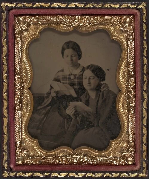 AMBROTYPE: READING, c1865. Portrait of two women reading letters. Ambrotype, c1865