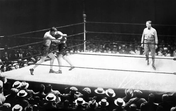 American boxer. Jack Dempsey and Jack Sharkey in the second round of their heavyweight boxing match at Yankee Stadium, 21 July 1927
