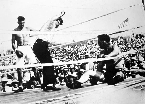 American boxer. Jack Dempsey (left) winning the heavyweight championship from Jess Willard on 4 July 1919 at Toledo, Ohio