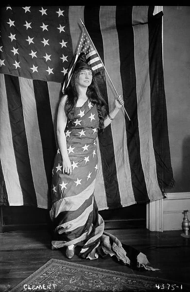 AMERICAN FLAG COSTUME, 1917. Opera singer Fely Clement wearing a liberty cap