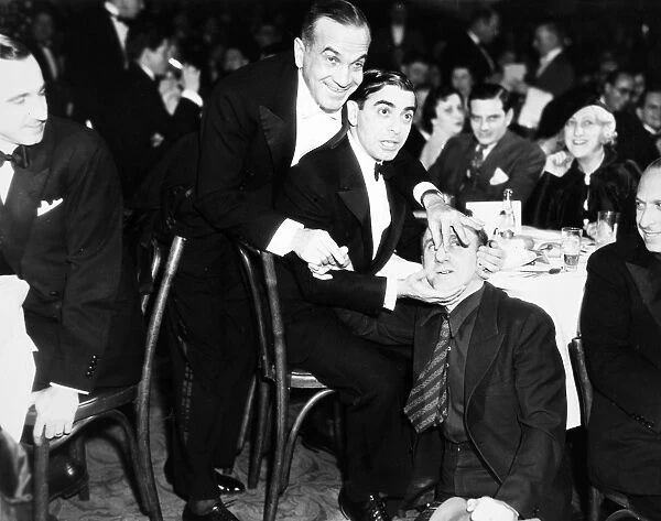 American singer. At a nightblub with Eddie Cantor (seated) Jimmy Durante (on the floor), 1935