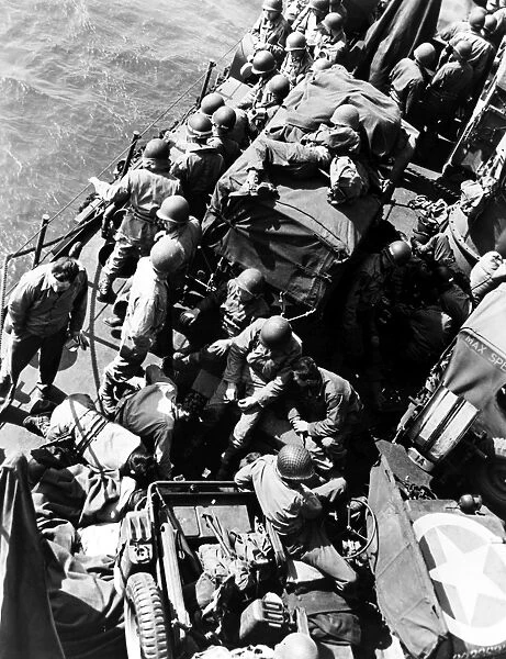 American soldiers aboard a U. S. Coast Guard landing craft prior to the invasion of Normandy, France, 6 June 1944