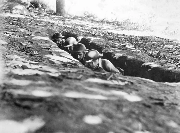 American soldiers ducking shrapnel at Bataan, Philippine Islands, February 1942