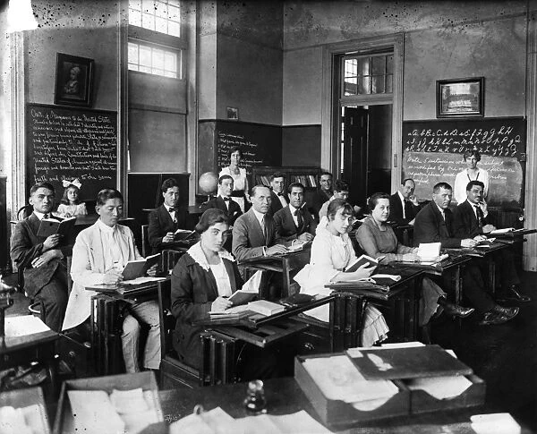 AMERICANIZATION CLASS, c1920. Recent immigrants to the United States in an Americanization