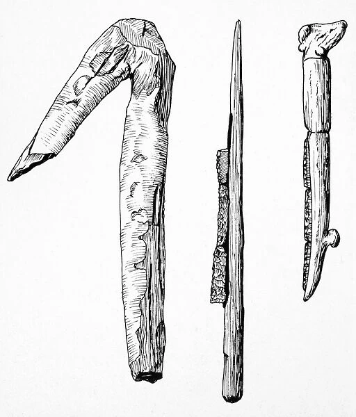 ANCIENT FARMING TOOLS. A wooden hoe and a flint-bladed sickle with wooden handle from Egypt