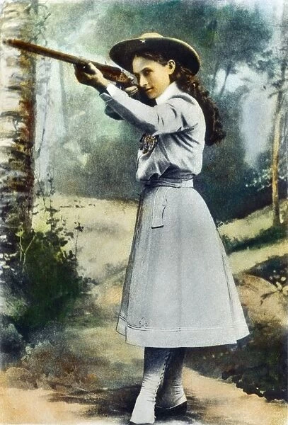 ANNIE OAKLEY (1860-1926). American markswoman: oil over a photograph, 1899