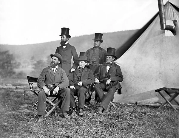 ANTIETAM: OFFICIALS, 1862. American (Scottish-born) detective Allan Pinkerton (seated at left), and other officials from Washington, D. C. at Antietam, Maryland, September 1862