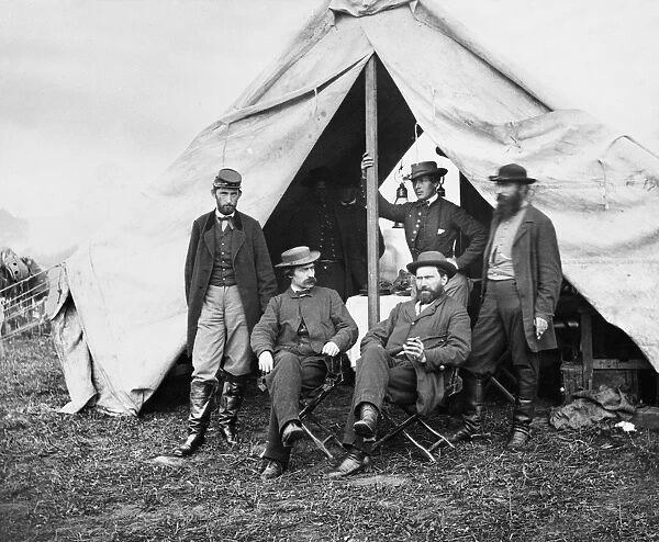 ANTIETAM: OFFICIALS, 1862. Union officials at Antietam, Maryland, during the American Civil War, October 1862. Seated left to right: war correspondent William R, Moore and detective Allan Pinkerton. Standing left to right; George H. Bangs, John C. Babcock and Augustus K. Littlefield. Photograph by Alexander Gardner