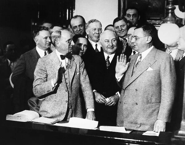 ANTON CERMAK (1873-1933). American (Czech-born) politician. Being sworn in as mayor of Chicago, Illinois, by Judge Edmund K. Jarecki (left), while County Clerk Robert M. Sweitzer (center) looks on, 9 April 1931