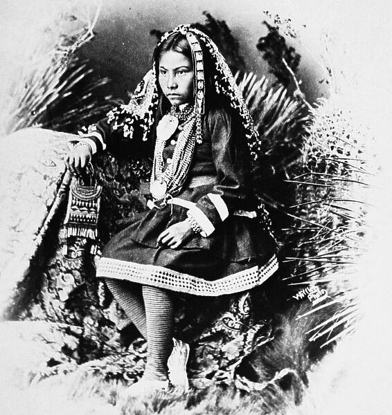 APACHE GIRL, 1886. A Chiricahua Apache girl, the granddaughter of Cochise, photographed in traditional costume, 1886