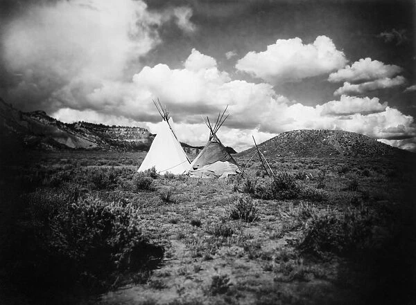 APACHE TEPEES, c1909. Two Apache tepees in Arizona. Photograph, c1909