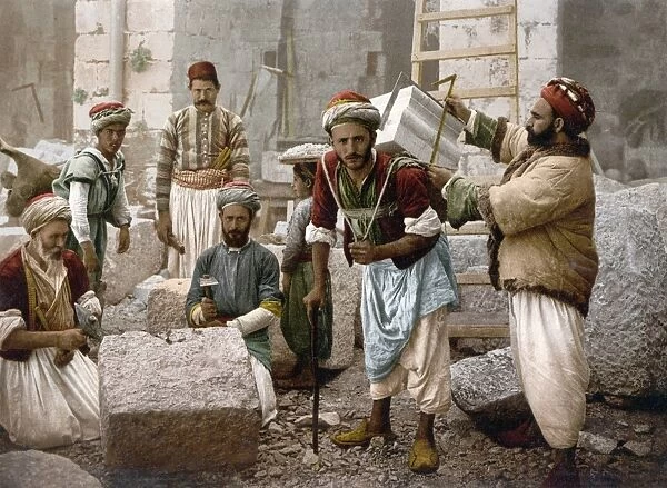 ARAB STONEMASONS, c1900. Arab stonemasons at work in Jerusalem. Photochrome, c1900