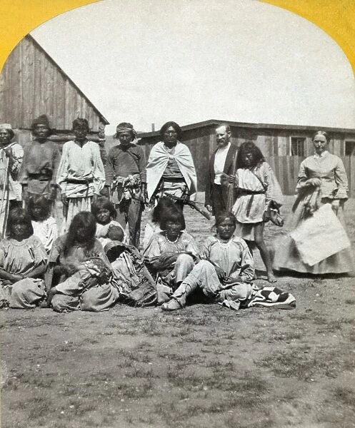 ARIZONA: APACHES, c1873. Group of Coyotero Apaches and their agent at Camp Apache, Arizona