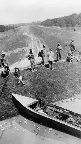 ARKANSAS: HELENA, 1927. Men resting on a levee, Helena, Arkansas