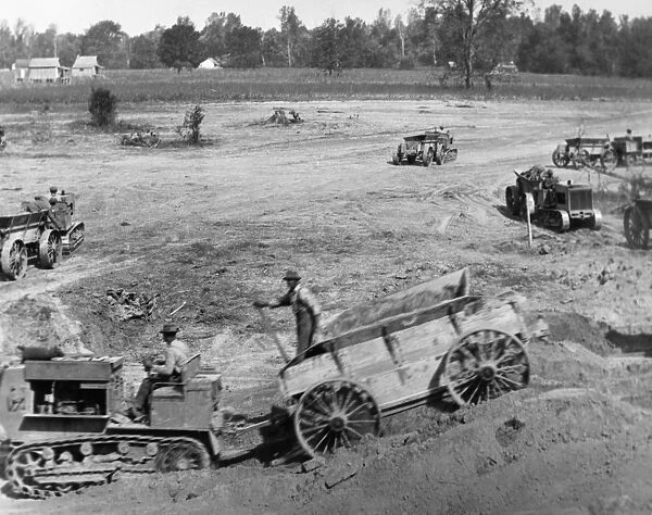 ARKANSAS: LEVEES, 1922. Construction of levees using tractor-drawn wagons near Wyanoke
