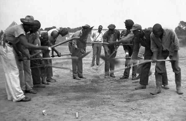ARKANSAS: PRSIONERS, 1934. African American convicts working with shovels, possibly