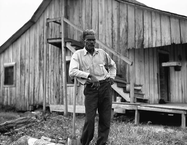 ARKANSAS: SHARECROPPER. An African American cotton worker dressed in Sunday clothes