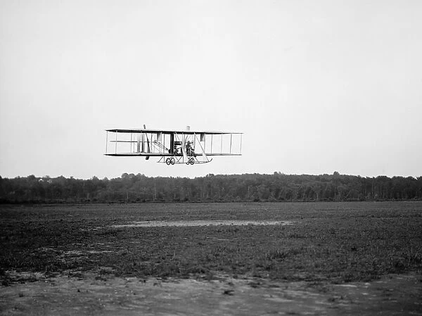 Army officer piloting a Wright biplane at College Park Aviation Field, Maryland, 1912