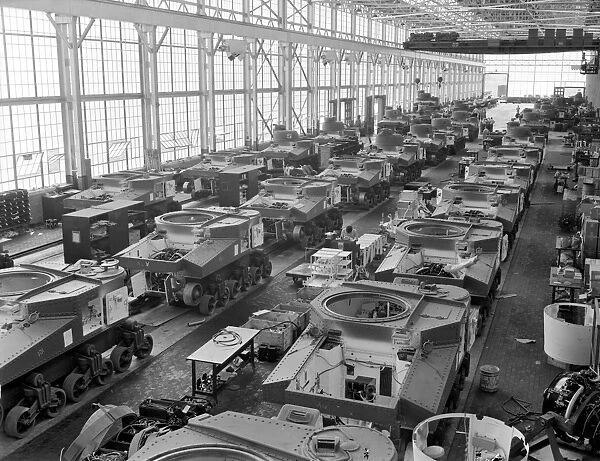 Assembly line production of M3 tanks at a Chrysler plant in Detroit, Michigan, during World War II. Photographed by Alfred T. Palmer, c1944