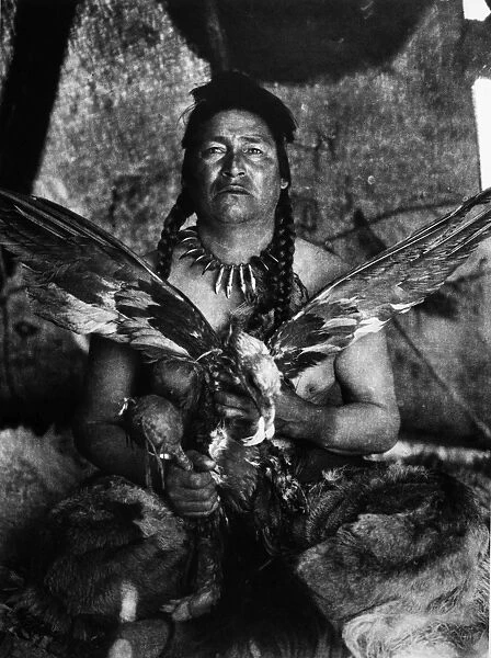 ASSINIBOIN AND EAGLE, 1926. An Assiniboin man placating the spirit of a slain eagle