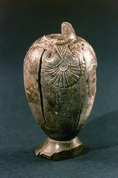 ASSYRIAN JUG. Jug made of ivory. From Nimrud, Assyria. 9th-8th century B. C