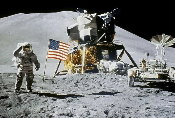 Astronaut Jim Irwin saluting the American flag by the lunar rover and the lunar module Falcon at the Hadley-Apennine landing site, during the Apollo 15 mission, 1 August 1971. Hadley Delta is visible in the background. Photographed by Astronaut David R. Scott