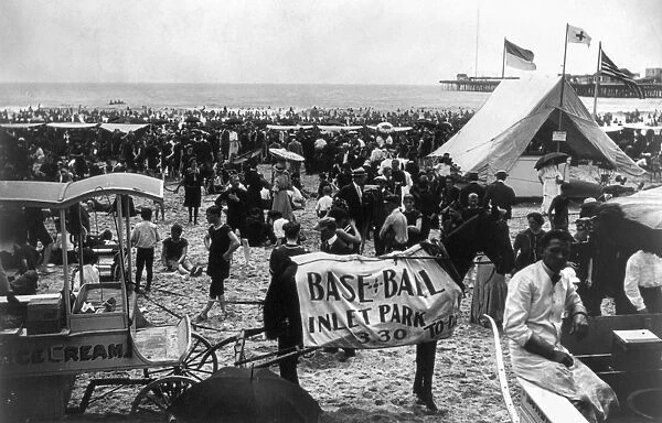 ATLANTIC CITY: BEACH. A crowded beach with a horse wearing a blanket advertising
