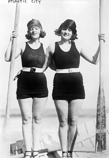 ATLANTIC CITY: WOMEN. Two young women wearing swimsuits in a standing pose at the beach, possibly taking part in a beauty contest, Atlantic City, New Jersey. Photograph, late 19th or early 20th century