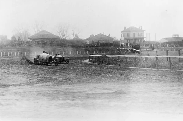 AUTO RACE, 1916. A Stutz Weightman Special and other racecars going around a turn