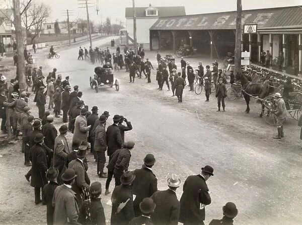 AUTO RACE, c1900. Spectators watching at the finish line of an auto race in Springfield, Long Island, New York. Photograph by James H. Hare, 1900