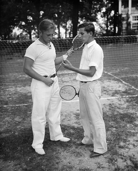 BADMINTON, c1936. Two badminton players. Photograph, c1936