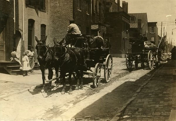 BALTIMORE: CARRIAGES, 1910. Horse-drawn carriages in Fells Point, Baltimore, Maryland