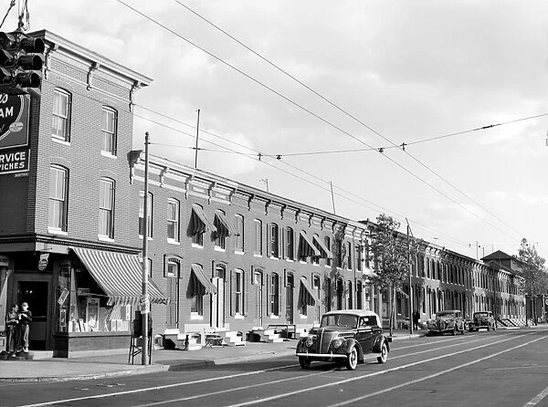 BALTIMORE: ROW HOUSES. A view of row houses along a street in Baltimore, Maryland
