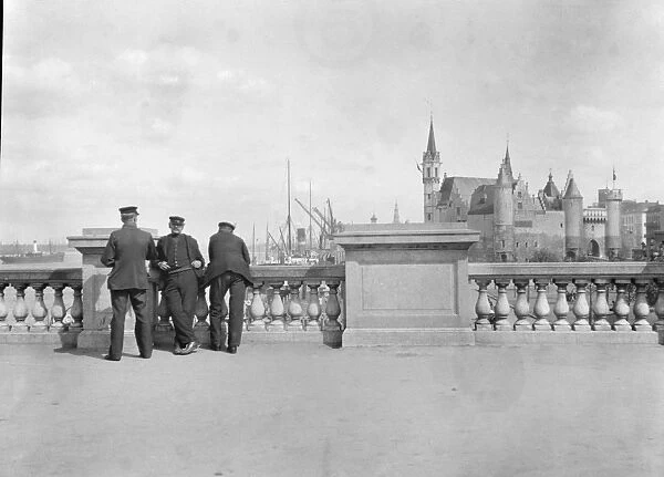 BELGIUM, c1910. Men posing in front of Het Steen in Antwerp, Belgium. Photograph by Arnold Genthe