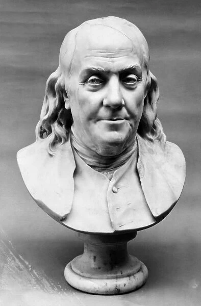 BENJAMIN FRANKLIN (1706-1790). American printer, publisher, scientist, inventor, statesman and diplomat. Marble bust, 1778, by Jean Antoine Houdon (1741-1828)