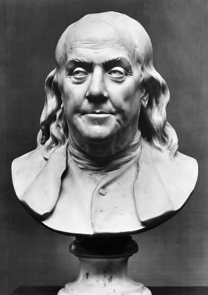BENJAMIN FRANKLIN (1706-1790). American printer, publisher, scientist, inventor, statesman and diplomat. Marble bust, 1778, by Jean-Antoine Houdon